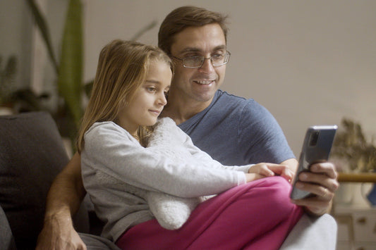 Parent video calling kids from a hotel room while traveling for work
