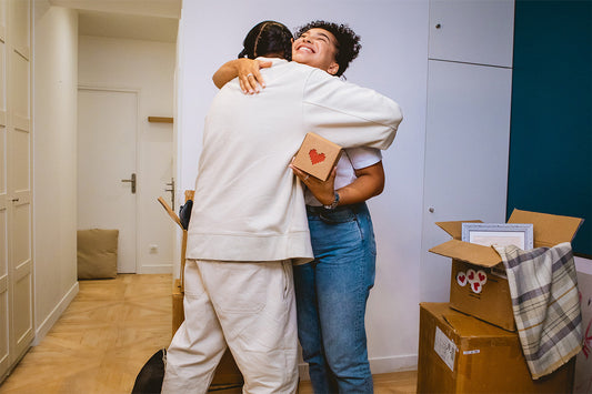 A girl doing a hug to a man because he gifted a Lovebox to her.